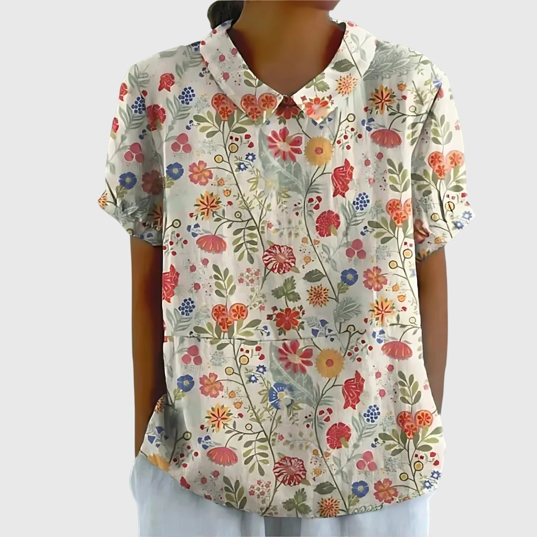 Blusa de manga corta para mujer con detalle floral en el cuello