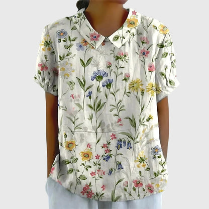 Blusa de manga corta para mujer con detalle floral en el cuello