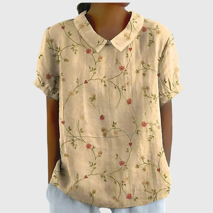 Blusa de manga corta para mujer con detalle floral en el cuello