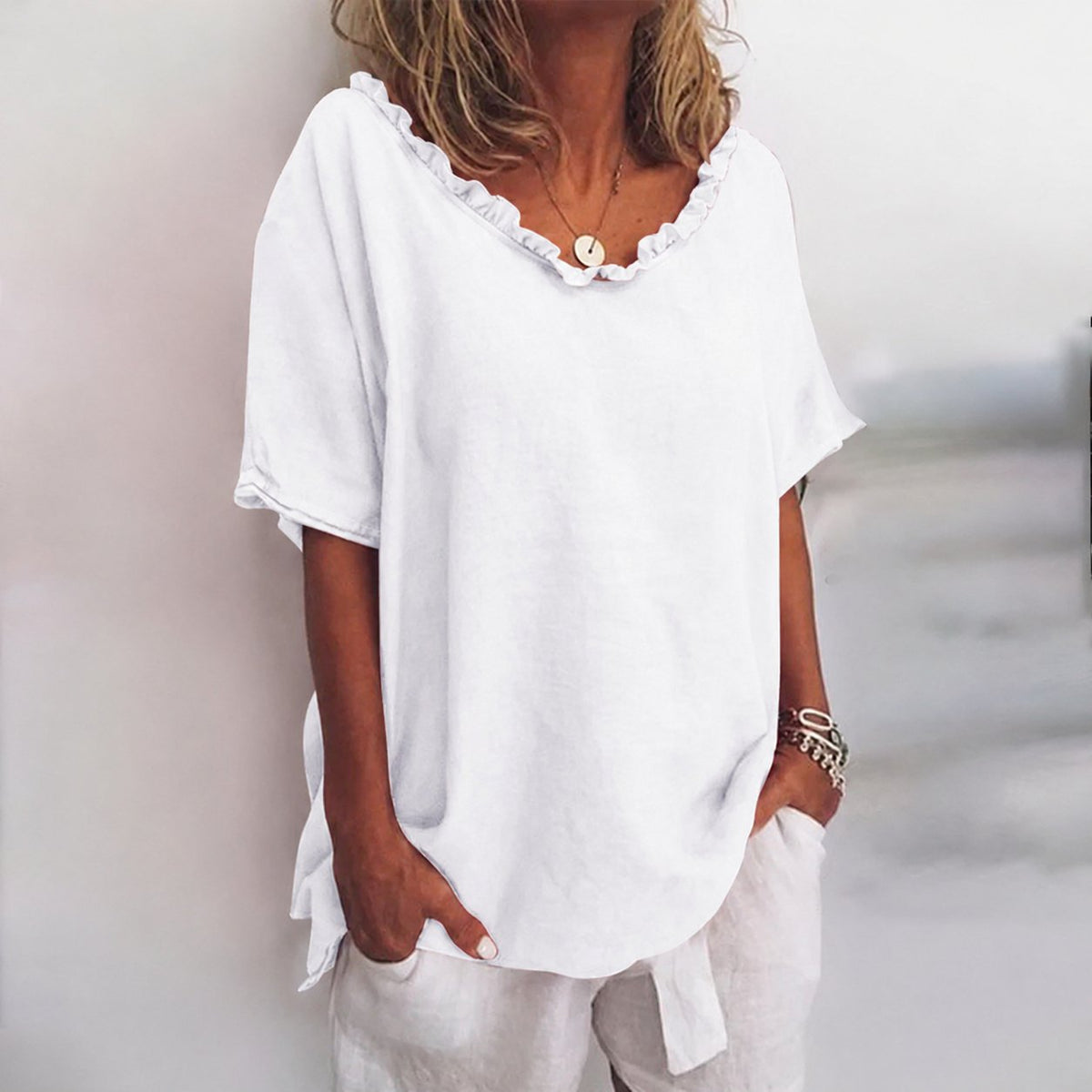 Blusa holgada de algodón con volantes y manga corta para mujer