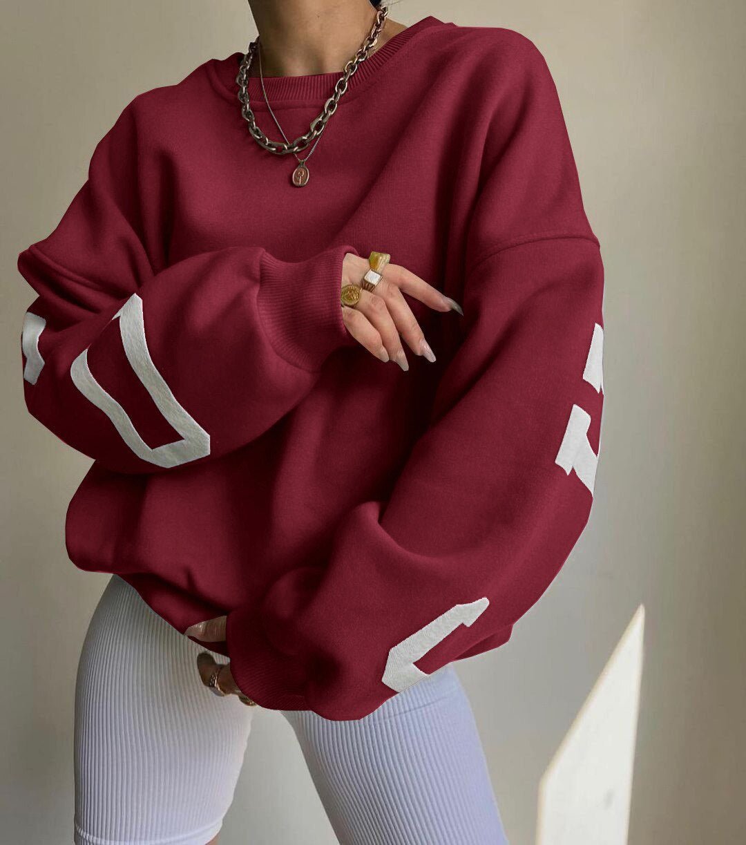 Polerón oversize de polar con diseño universitario para mujer